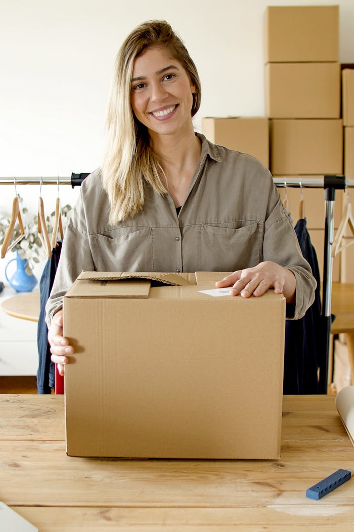 Woman managing online store packaging for small business indoors.